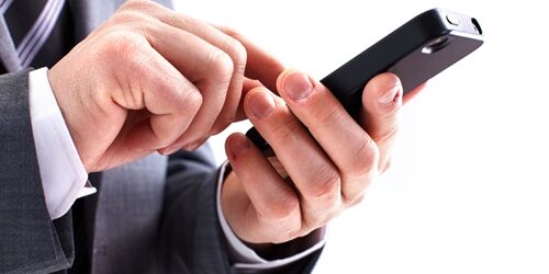 4 Ways To Master Mobile Marketing man looking at his phone