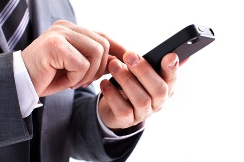 4 Ways To Master Mobile Marketing man looking at his phone