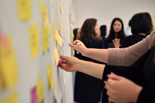 Brand managers work with every aspect of the company to make sure their strategy meets all goals. People planning a brand strategy.