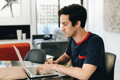 Freelancers can help you tackle creative projects with lower costs than bringing on full-time employees. freelancer working on laptop