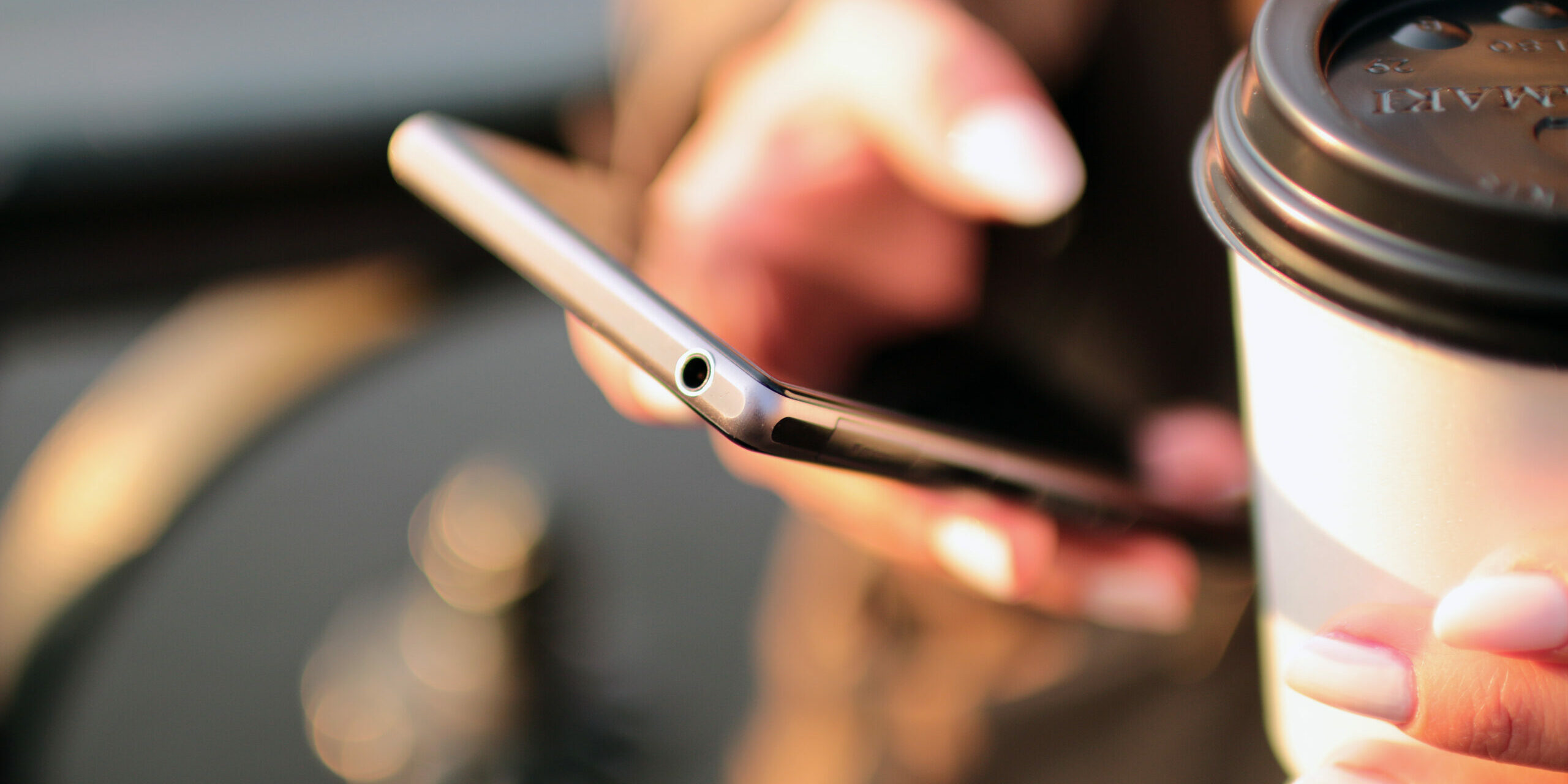 How to Be A More Successful Mobile Designer mobile phone in hand with coffee