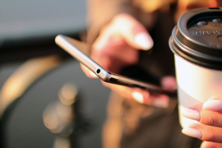 How to Be A More Successful Mobile Designer mobile phone in hand with coffee
