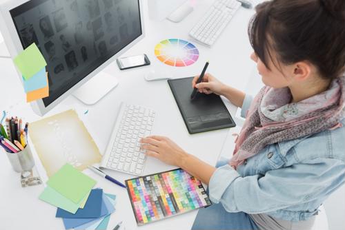 If you’re looking to boost your company’s creative and digital services, it pays to invest in the right talent. creative and digital talent working at desk