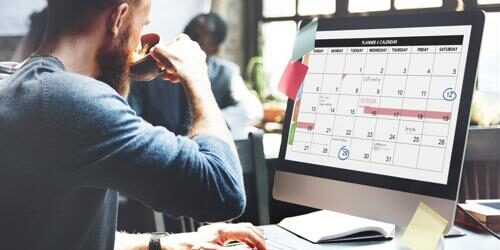 Web content manager referencing editorial calendar for site content creation. Technology staffing experts match companies with the web content manager they need.