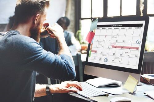 Web content manager referencing editorial calendar for site content creation. Technology staffing experts match companies with the web content manager they need.