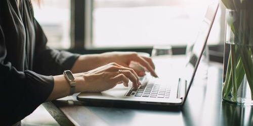 Web content managers create and oversee all copy that appears on a company’s website. web content manager typing on laptop