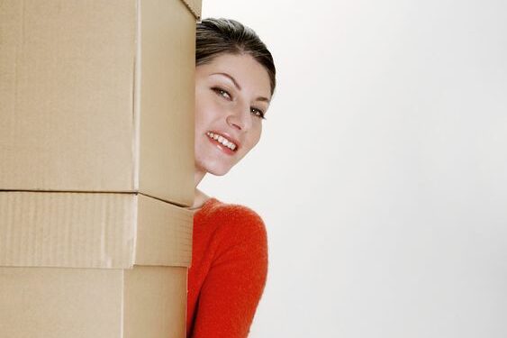 Woman-Carrying-Boxes Woman carrying large boxes