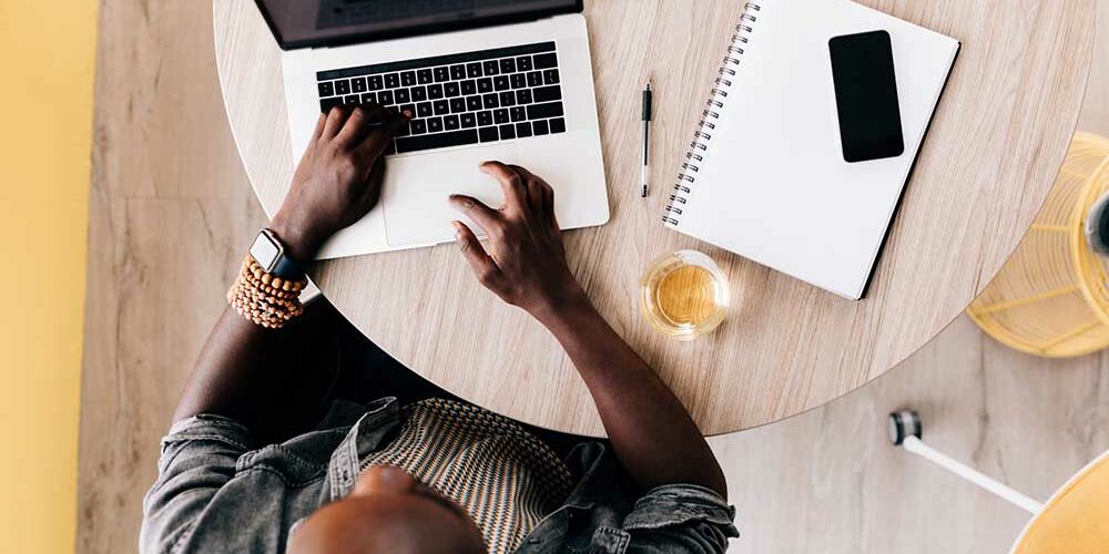 a day in the life of a copywriter copywriter sitting at desk working