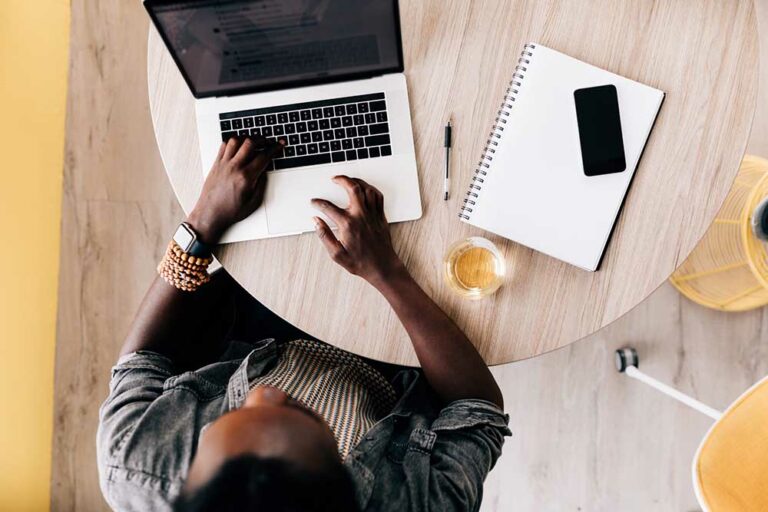 a day in the life of a copywriter copywriter sitting at desk working