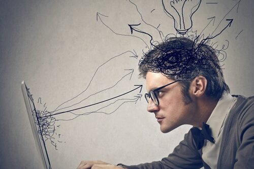 Aside from proper grammar and stellar proofreading skills, there are many other qualities to look for in your next copywriter. man working on a laptop with cartoon arrows and lightbulb all over his head