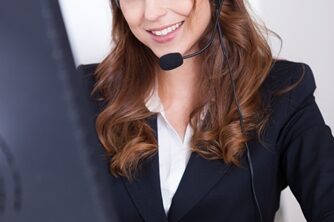 Benefits of Outbound Marketing Woman working in a call center smiling a the camera