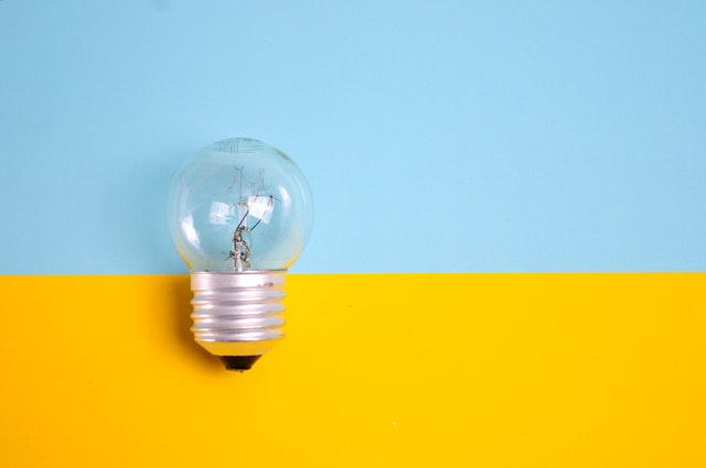 best ted talks for career growth inspiration and overall well being light bulb against blue and yellow background