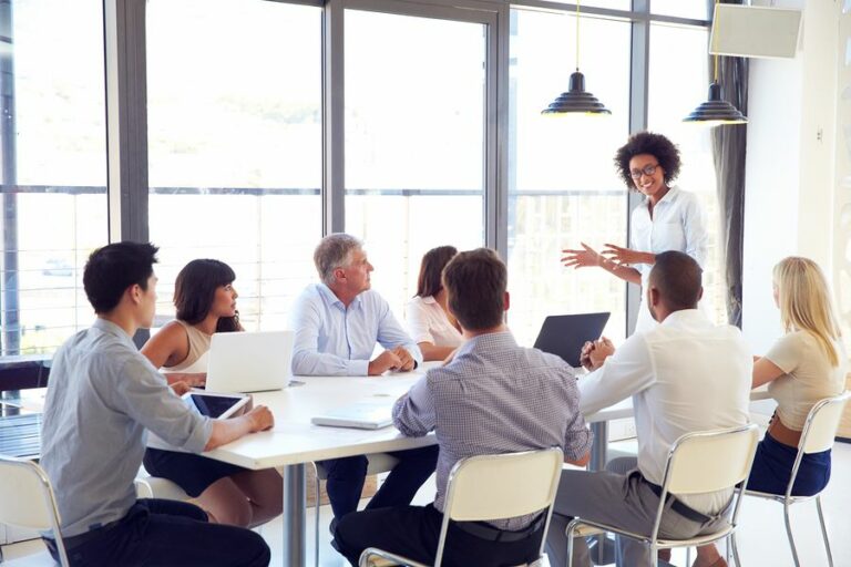 A women discussing ideas with Corporate Communications Recruiters A women discussing ideas with Corporate Communications Recruiters