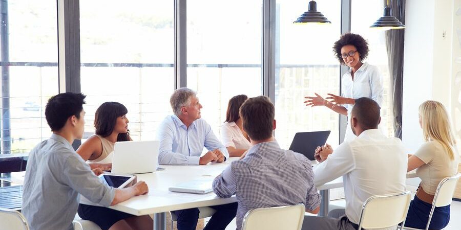 A women discussing ideas with Corporate Communications Recruiters A women discussing ideas with Corporate Communications Recruiters