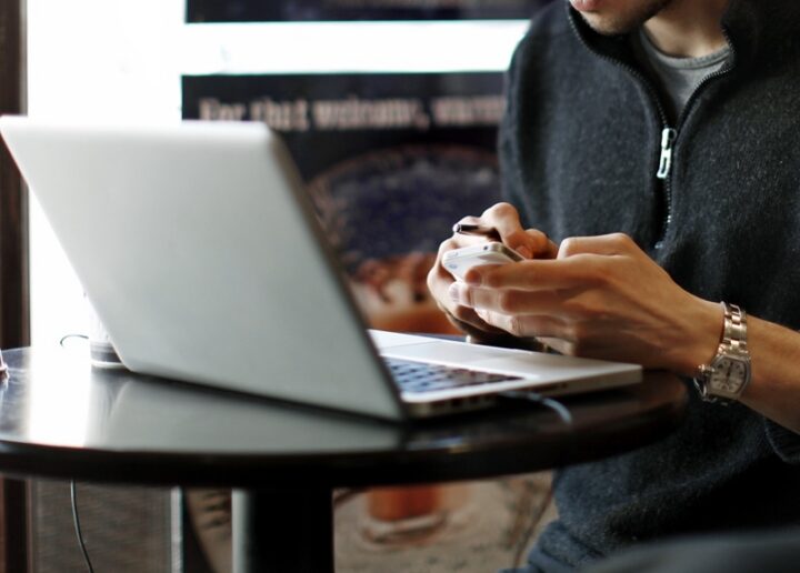 candidate on phone at computer web designer at the computer