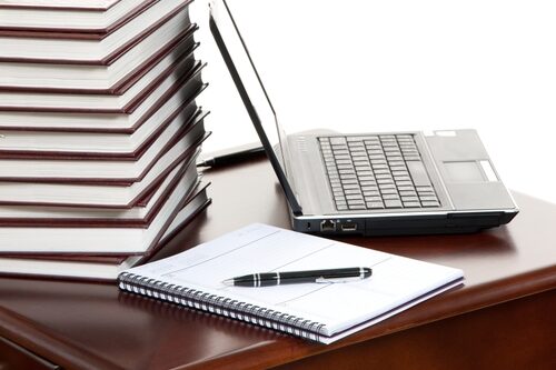 Content marketing – Are you ready? journal sitting at a table with a laptop next to in and a pen on top