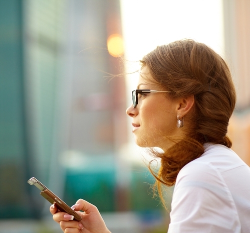 Creative staffing solutions: Benefits of hiring contract workers Woman on her phone looking out into the distance