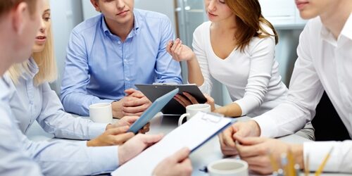 Effective marketing strategies to boost brand recognition Group of people crowded around a table in a meeting