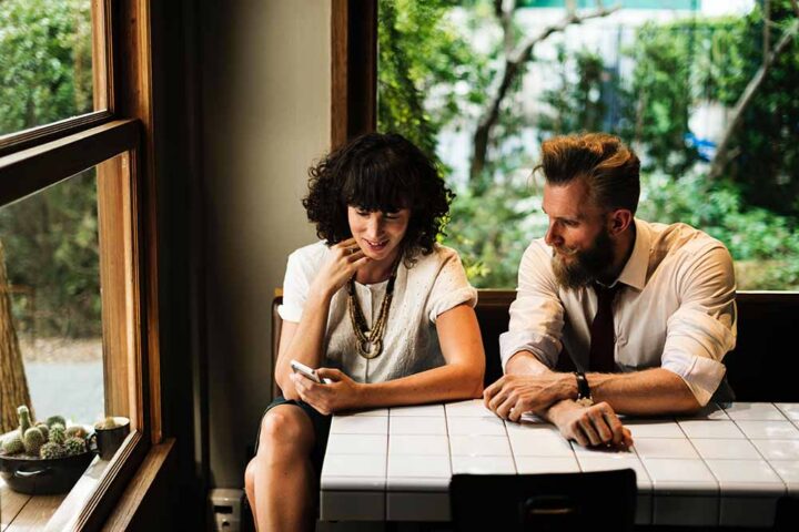 friends-having-conversation-in-coffee-shop friends-having-conversation-in-coffee-shop