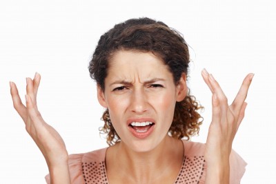 frustrated woman looking at the camera frustrated