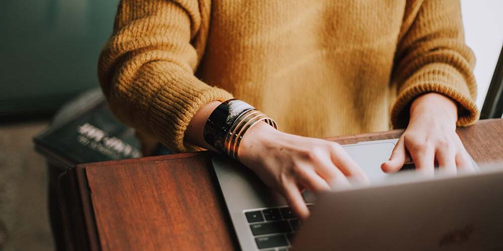 woman-on-computer-creating-resume Woman on computer creating resume using creative resume tips