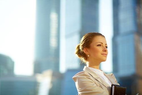How to create a content dream team woman smiling in front of window