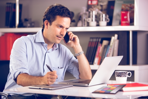 In the age of LinkedIn, About.Me, and the raging “you are your network” mentality that abounds when it comes to landing your next gig, traditional resumes aren’t going to cut it. a man on his phones as he works on his laptop at his desk