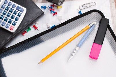 list office supplies sitting on a desk