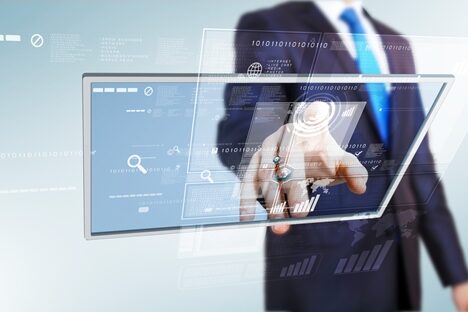 Persuade your employer to create tech jobs man touching a see through screen