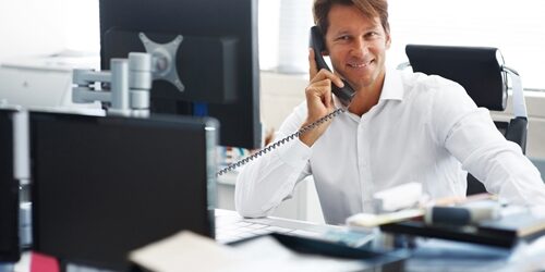 Planning Out Your Hiring Strategy hiring manager at desk