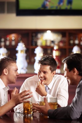 pub 3 men after work in a pub