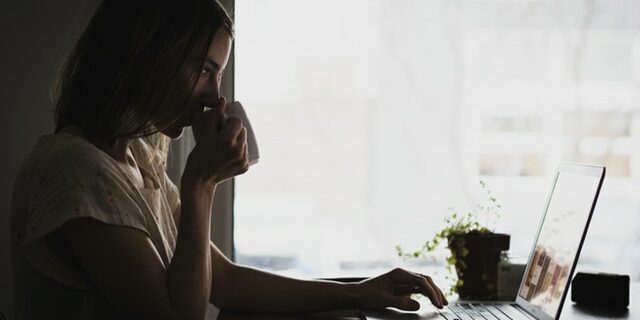 recruiting trends to enhance your talent experience candidate searching for jobs sipping coffee mug