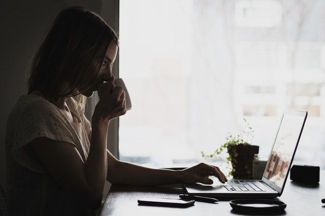recruiting trends to enhance your talent experience candidate searching for jobs sipping coffee mug