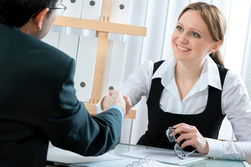 Secure and succeed at job interviews in the coming year woman interviewing a man