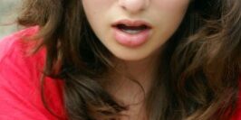 socialmediashocked woman angry as she looks at her phone