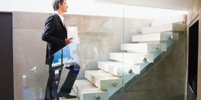 stairs man walking up a flight of stairs