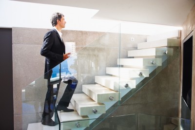 stairs man walking up a flight of stairs