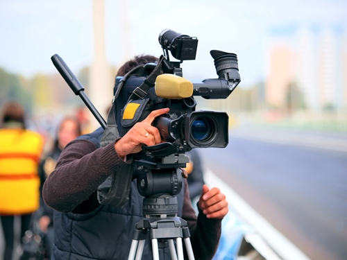 The high ROI of video content marketing Camera man working