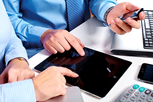 The role of a web business analyst two people working at a tablet on a desk