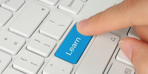 Top 3 tools for sharing great content Person pushing a button on a keyboard that says learn