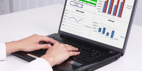 Web design trends that will dominate 2014 computer with graphs and charts on it