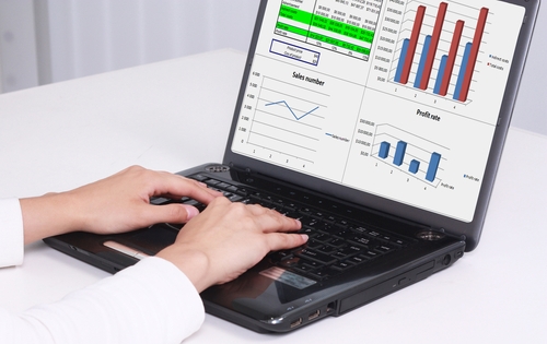 Web design trends that will dominate 2014 computer with graphs and charts on it