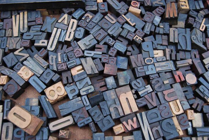 copwriting-trends-2021-letters Wooden blocks with letters and numbers all laying in a jumble on the floor.