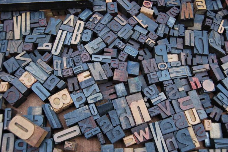 copwriting-trends-2021-letters Wooden blocks with letters and numbers all laying in a jumble on the floor.