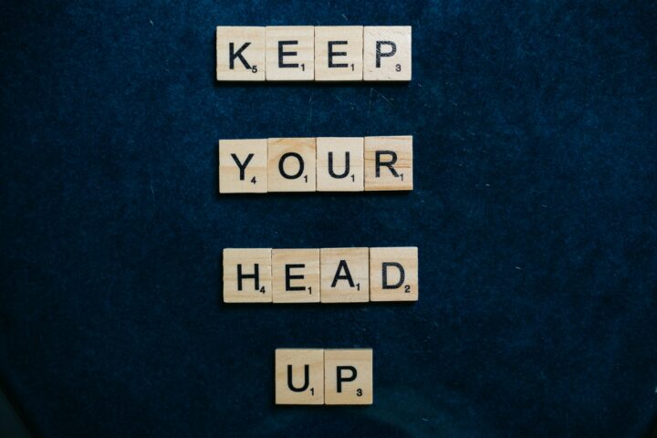 performance improvement plans Scrabble pieces spelling out keep your head up for performance improvement plans