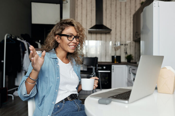 new job remote onboarding woman with coffee on computer starting new job