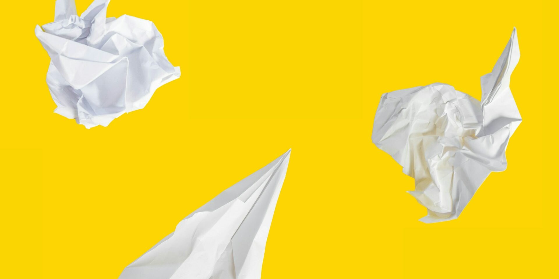 building and recruiting for a culture of innovation yellow background and crumbled up pieces of paper signifying innovation