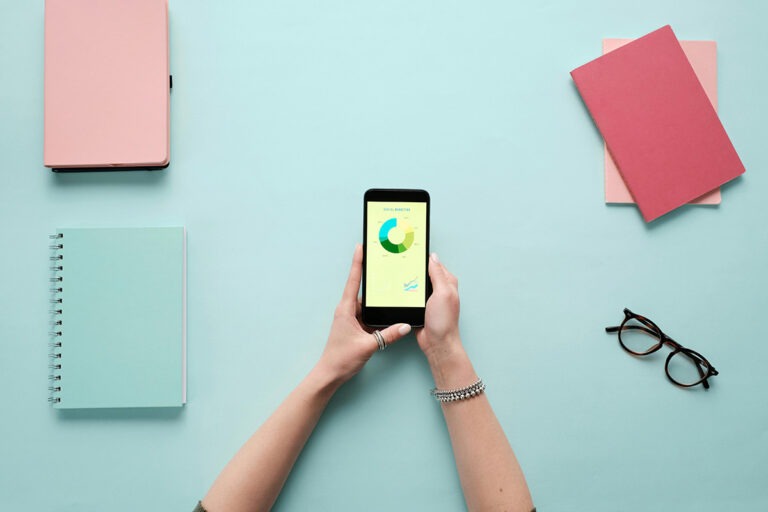 top marketing talent top marketing talent with light blue background and a graph on a phone