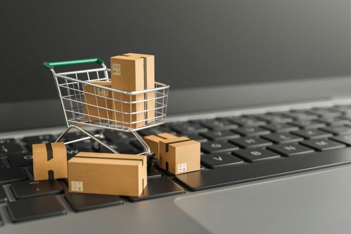 CMO in Consumer Packaged Goods CMO in Consumer Packaged Goods - mini shopping cart with boxes on laptop