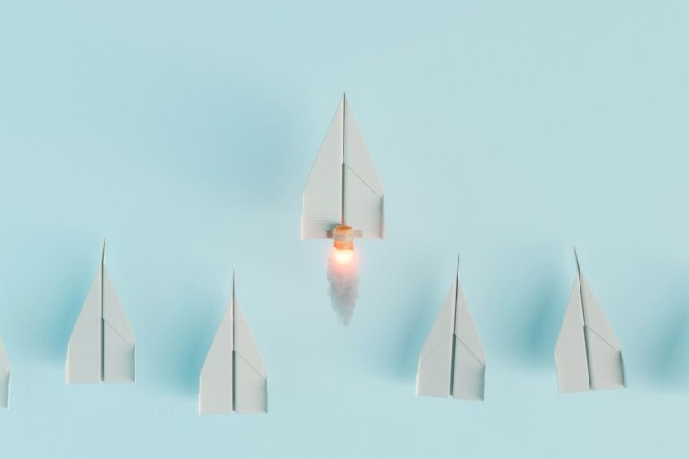 the impact of executive leadership on company culture and innovation paper airplanes in a line with one taking off to symbolize leadership